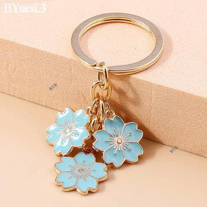 Bijou de Sac Fleurs Émaillées Verger – bijou de sac floral